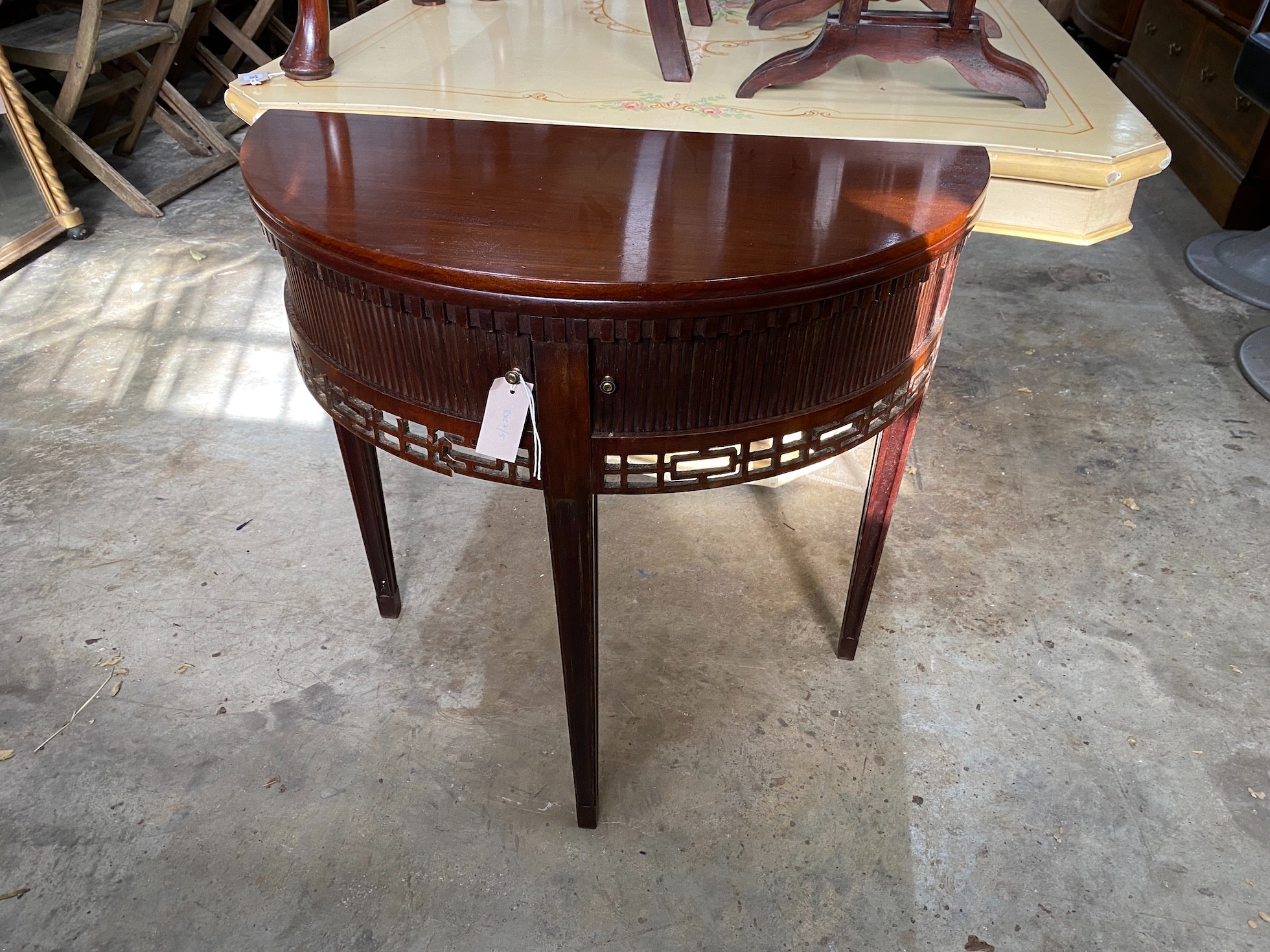 A reproduction George III style mahogany demi lune folding tea table, width 77cm, depth 38cm, height 75cm